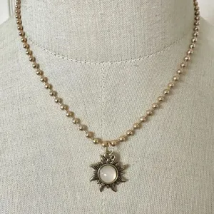 Gold tone sun pendant necklace thumbnail 2