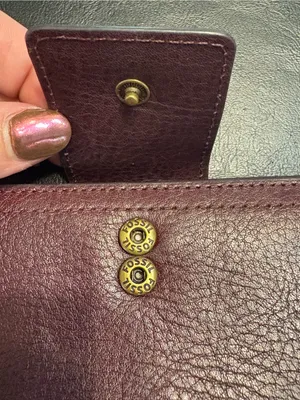 Fossil pebbled leather tab clutch wallet in a deep burgundy or berry color thumbnail 10