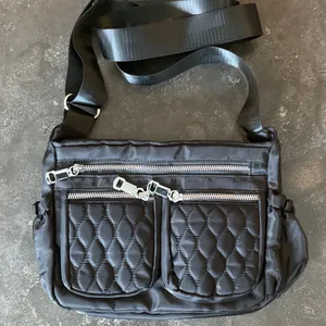 Black Quilted Crossbody Bag with Front Zipper Pockets thumbnail 1