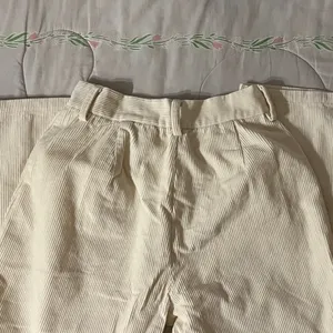 Cream high-waisted corduroy straight leg pants. thumbnail 4