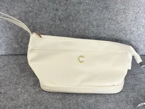 C Cream Leatherette Wristlet Cosmetic Pouch with Gold C Accent thumbnail 1
