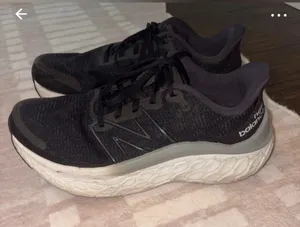 New Balance Black Athletic Running Shoes with White Midsole thumbnail 1