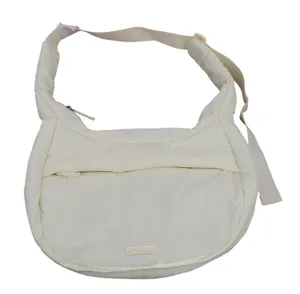 Athleta Puffer Crossbody Bag Cream Yellow Quilted Nylon Hobo Adjustable Strap thumbnail 1