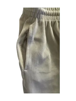 PINK Victoria's Secret Cream Velour Lounge Pants-size large Casual lounge pants from PINK by Victoria's Secret. Elastic drawstring waistband for a comfy fit. Smooth fabric with a relaxed wide-leg silhouette, has hand pockets, embroidered “pink” on one leg, 93% polyester and 7% elasttane, excellent condition Measurements: Waist: side to side 17-21 inches Rise: 11 inches Inseam: 30 inches thumbnail 4