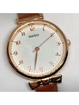 Women’s quartz analog watch gold tone 34mm round case brown leather band running thumbnail 2