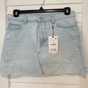 New Zara Ripped Denim Mini Skirt Sz L Distressed Hem Light Blue NWT thumbnail 1
