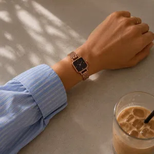 Rose gold watch with black accents thumbnail 1