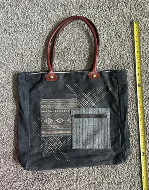 Mono B Black Canvas Tote with Brown Handles and Patterned Front Pockets thumbnail 1