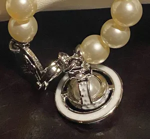 Vivienne Westwood faux pearl and Saturn orb pendant choker, new. thumbnail 4