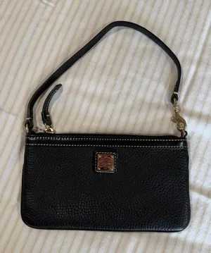 Dooney & Bourke black pebbled leather slim zippered wristlet with gold hardware thumbnail 1