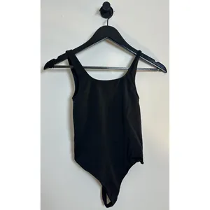 SKIMS Soft Smoothing Seamless Thong Bodysuit in Onyx Black Size X-Small thumbnail 2