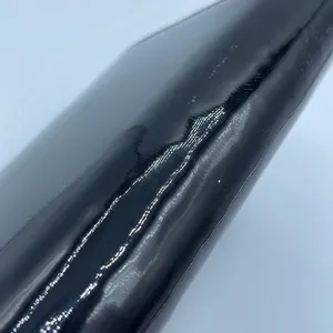 Black faux patent leather clutch with wave design on front. thumbnail 4