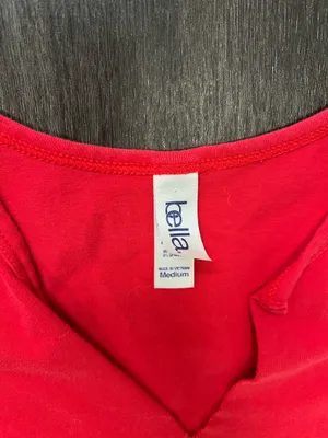 Bella Canvas Comfortable red sleeveless V-neck top with Huskers chest logo. Soft, breathable fabric for everyday wear. Clean, fitted silhouette that layers easily. Machine washable for easy care. size medium thumbnail 2
