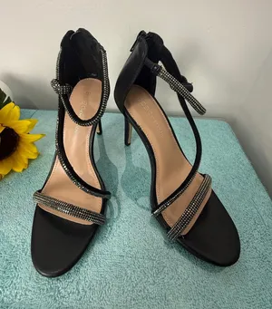 BCBGeneration Black Strappy Crystal-Embellished Stiletto Heels thumbnail 1