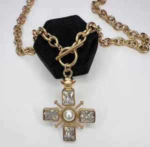 Chunky gold cross necklace with pearl and toggle clasp thumbnail 1