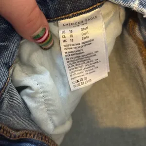 American Eagle blue bootcut jeans with distressed details size 10 SHORT thumbnail 4