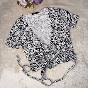 Brandy Melville Black and White Dotted Wrap Top thumbnail 1