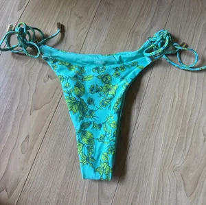 Women’s Teal Floral Tie thumbnail 1