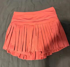Pleated Gold Hinge Tennis Skirt in Magenta thumbnail 1