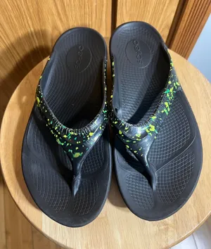 OOFOS Black Flip Flop Sandals with Neon Green Splatter thumbnail 1