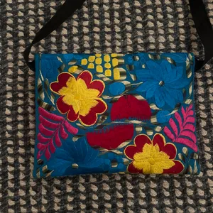 Blue and yellow crossbody bag with a unique, hand-sewn design No flaws and perfect condition/never used Zipper and additional pockets inside thumbnail 4