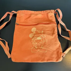 Disney parks, Walt Disney World‎ Orange Drawstring Backpack with Disney Logo thumbnail 1