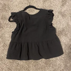 Black babydoll top with puff sleeve thumbnail 2