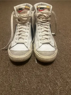 Nike White High-Top Sneakers with Black Swoosh and Yellow Tongue Tab thumbnail 2