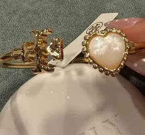 Tory Burch | Gold Plated Logo & Mother of Pearl Heart Bangle | Medium thumbnail 1