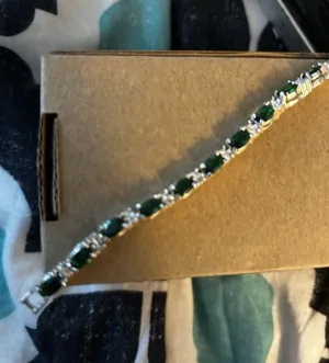 Green and silver colored Avon bracelet thumbnail 1