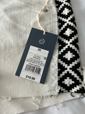 White High-Rise Raw Hem Shorts With Black Tribal Detail thumbnail 3