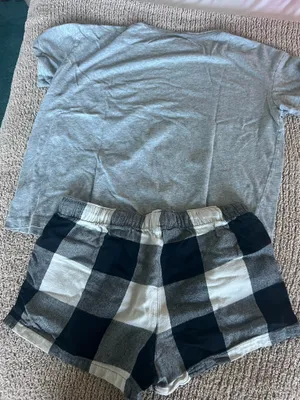 Old Navy Cozy set featuring a gray short sleeve tee with a small "LOVE" graphic. Includes black and white plaid drawstring lounge shorts. Soft, casual pieces perfect for lounging or sleepwear. thumbnail 5