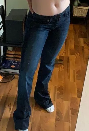 Dark colored flare jeans thumbnail 1