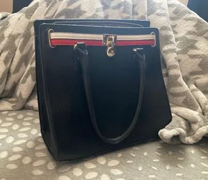 Black handbag/crossbody with red and white stipe Cheetah print interior design Plenty of zippers thumbnail 5