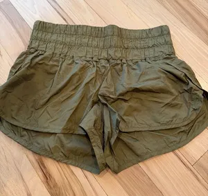 FP Movement by Free People "Way Home" shorts in an olive green color thumbnail 1