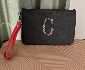 Thirty-one Wristlet bag embroidered with a floral “C” thumbnail 1