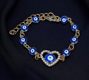 Gold tone evil eye heart bracelet thumbnail 1