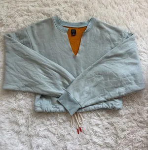 BDG Urban Outfitters cropped blue sweater with orange lining and adjustable tie thumbnail 1