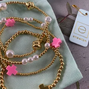 Enewton 4‑Piece Stackable Bracelet Set Gold Bead Pink Cross Pearl Detail thumbnail 1