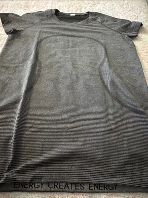 Lulu lemon 🍋 Striped Gray swiftly T-Shirt with 'ENERGY CREATES ENERGY' Hem thumbnail 1