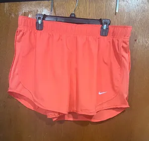 Nike Women's Coral Athletic Shorts with White Swoosh thumbnail 1
