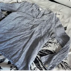 “The Tunic Shirt” from Old Navy in a soft, cool-toned gray thumbnail 2