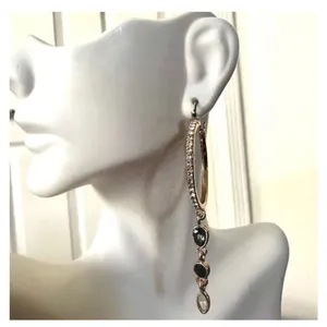 Gold tone hoop earrings with dangling rhinestones thumbnail 2