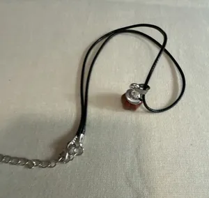 Goldstone Pumpkin Pendant Necklace on Black Cord thumbnail 1