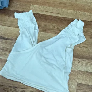 Billabong white / Cream ribbed cris-cross crop tank with Ruffled Sleeves medium thumbnail 1