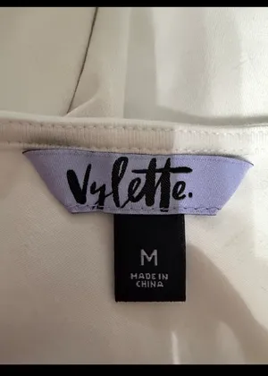 Vylette White bodysuit with Puffy Sleeves - Size Medium. ***refer to measurements. Super Cute top gentle worn and in excellent condition. Cotton/ spandex material. Measurements approximately for the bodysuit/ 14” from armpit to armpit x 25” from shoulder to snaps in crotch. Non-smoking home. Priced to sell at as is condition. Don’t like my price please make reasonable offer. thumbnail 3