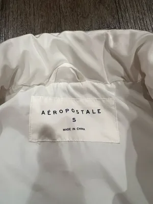 Aeropostale Stay warm and stylish with this sleek white puffer vest. Perfect for layering in cooler weather. thumbnail 2