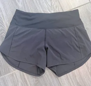Women's Lululemon Black Speed Shorts 4” inseam size 2 EUC thumbnail 1