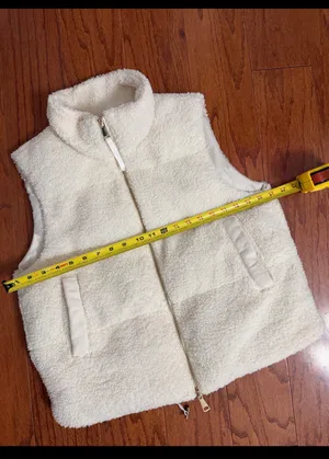 SHEIN Cream sherpa fleece fluffy puffer Zip up Vest with bag - size Medium. ***refer to measurements for size. Gently Warn and excellent condition. Measurements approximately from armpit to armpit 21” not fully stretched out x 22” long. Non-smoking home. Priced at as is condition. Don’t like my price make a reasonable offer! And thank you for checking my closet! thumbnail 7