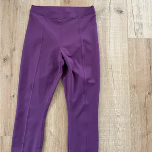 Alo Yoga Airlift Suit Up Stirrup Leggings in a gorgeous plum purple shade thumbnail 3